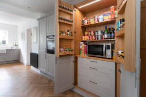 a clean line shaker kitchen in traditional painted colours.